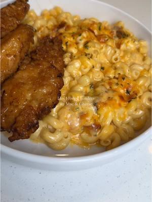 Hot honey tenders with Mac and cheese 😋🍗🧀 bringing this back because y’all loved it, also perfect for Christmas! 🎄happy holidays to everyone! Ingredients below👇🏾 Chicken marinade:  - 3 chicken tenders  - 1 cup buttermilk  - 1/4 cup hot sauce  - Seasonings, 1 tsp each salt, black pepper, garlic powder, onion powder, cayenne  Dry coating:  - 1 cup flour  - Seasonings, 1 tsp each salt, black pepper, garlic powder, onion powder, cayenne  Wet coating:  - 1 cup buttermilk  - 2 tbsp hot sauce  - Seasonings, 1 tsp each salt, and black pepper  Hot honey glaze:  - 4 tbsp butter, melted  - 1 tbsp hot sauce  - 1 tbsp honey  cheese sauce:  - 2 tbsp butter  - 1 tbsp flour  - 1 tsp minced garlic  - 2 cups heavy cream  - 4 tbsp cream cheese - Seasonings, 1 tsp each salt, black pepper, garlic powder, onion powder, paprika - 1 tbsp hot sauce  - 1/2 cup pasta water  - 8oz mild/sharp cheddar cheese  - 8oz Colby jack cheese  - 10oz mozzarella cheese  - 12oz cooked elbow macaroni  Cook on low-medium heat  Bake at 350F for 15-20mins, broil on low for 1min                         #hothoney #hothoneychicken #chickentenders #macandcheese #friedchicken #dinner #DinnerIdeas #EasyRecipe #simpledinner #easyrecipesathome #highprotein #cheesyfood 