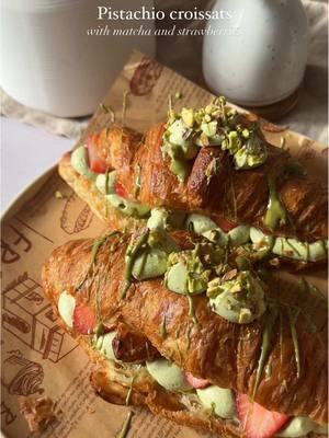 Pistachio, matcha, strawberry croissants🍓 Ingredients: 2 large croissants 1 c heavy cream 1 tsp matcha powder 2 tbsp pistachio cream Vanilla bean paste to taste 3 strawberries 1 tbsp crushed pistachios Steps: 1. Toast your croissants until golden brown and crispy 2. In the meantime, make your pistachio matcha cream by whisking together heavy cream, pistachio cream, matcha, and vanilla bean paste until it has stiff peaks 3. Cut your croissants and pipe your cream inside topping with sliced strawberries 4. Add more cream on top, crushed pistachios, and a drizzle of pistachio cream and enjoy! #Recipe #recipeoftheday #cooking #matcha #croissants #pistachio #pistachiocream #pistachiocroissant #croissant #croissantrecipe #stuffedcroissant #homemade #dessert #matchapowder #strawberry #strawberrymatcha 