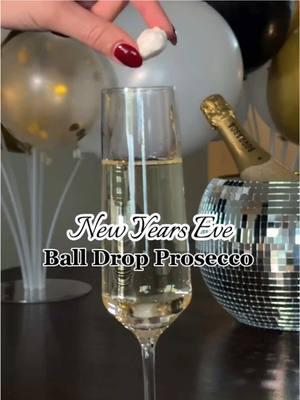 🥂SAVE this for your NYE party🥂 New Year’s Eve ball drop champagne toast! 🍾 All you need for this is cotton candy, edible glitter and champagne (or prosecco)! Ring in the new year with this fun and interactive toast with friends!  🛍️All items can be found on my L T K. I was able to find the cotton candy at Party City *neither the cotton candy nor glitter will impact the flavor of the champagne  #creatorsearchinsights #newyearseve #happynewyear #newyearseveparty #nye2025 #nye2024 #balldrop 