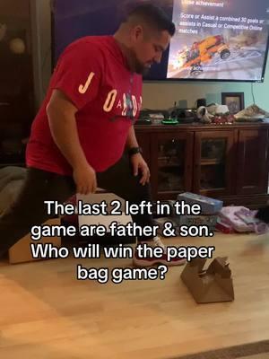 How it ends 🤣 #partygame #fyp #fatherson #paperbag #fungame #partygames #christmasparty #christmas2024 #christmasgames #funnyfamily #funnyvideo #fyppp #flexible #christmaspartygames 