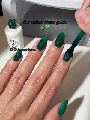 just 2 coats for the perfect jelly-like glassy deep green look 🪼🎄  Shade is DND 747 Aurora Green swatched by @kuypernailart 💅🏽 Click the link in our bio to shop #dndgelpolish #dndgel #greennails #jellynails #nailsinspiration #nails #winternails 