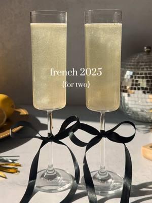 The French 75, but make it 2025! 🥂 This is the perfect cocktail to sip on into the new year - and it’s all tied up in a cutie bow!  Here’s how to make it: • French 2025 • (For two) Tie bows around base of flutes 3 oz gin 1.5 oz lemon juice 1 oz simple syrup Edible glitter Shake w/ ice Strain into champagne flutes Top w/ champagne Enjoy! #thatsthespirits #french2025 #french75 #champagne #gin #newyears #newyearseve #newyear #happynewyear #2025 #cocktail #drinkrecipe