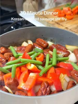 30 Minute Korean-Inspired Sausage Stir-Fry ✨ Ingredients: 	•	1 package beef little smokies (14 oz) 	•	1 red bell pepper, cut into bite-size squares 	•	1 medium onion, cut into bite-size squares 	•	1/2 lbs green beans, trimmed 	•	2 tbsp avocado or vegetable oil For the Sauce: 	•	1/2 cup water 	•	1/4 cup soy sauce 	•	2 tbsp honey 	•	1 tbsp sesame oil 	•	1 1/2 tbsp ketchup 	•	3 cloves garlic, minced 	•	1/2 tsp sesame seeds, more for garnish 	•	1 1/2 tsp cornstarch 	•	1/4 tsp salt, more if needed 	•	1/8 tsp black pepper, more if needed Instructions: 	1.	Prepare the little smokies: Score the sausages diagonally in both directions to create square patterns (optional).  	2.	Sauté: Heat the oil in a skillet over medium heat. Brown the Little Smokies for 2 minutes, then add the onion, bell pepper, and green beans to the skillet and stir-fry for 5 minutes until tender but crisp. 	3.	Make the Sauce: Whisk together water, soy sauce, honey, sesame oil, ketchup, garlic, cornstarch, salt, and pepper until smooth. 	4.	Combine: Pour the sauce over the Smokies and veggies. Cook for 3-4 minutes until the sauce thickens. 	5.	Serve: Serve hot over steamed rice or noodles. Quick, delicious, 30 minute dinner that’s perfect for a busy nights! #30minutemeals #quickrecipes #easydinnerrecipes #EasyRecipes #dinner #DinnerIdeas #littlesmokies #koreanfood #koreansausage #stirfry #sausagestirfry #cookdinnerwithme 