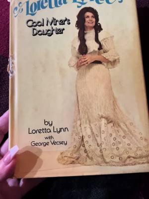 You can hear my family laughing and opening gifts in the background, but I had to run in the bedroom and cry for a minute over this 1980 copy of Coal Miner’s Daughter that my husband found me. Loretta beautiful handwritten message to a friend and her autograph. He is reading a chapter to me every night. #lorettalynn #vintage #life 