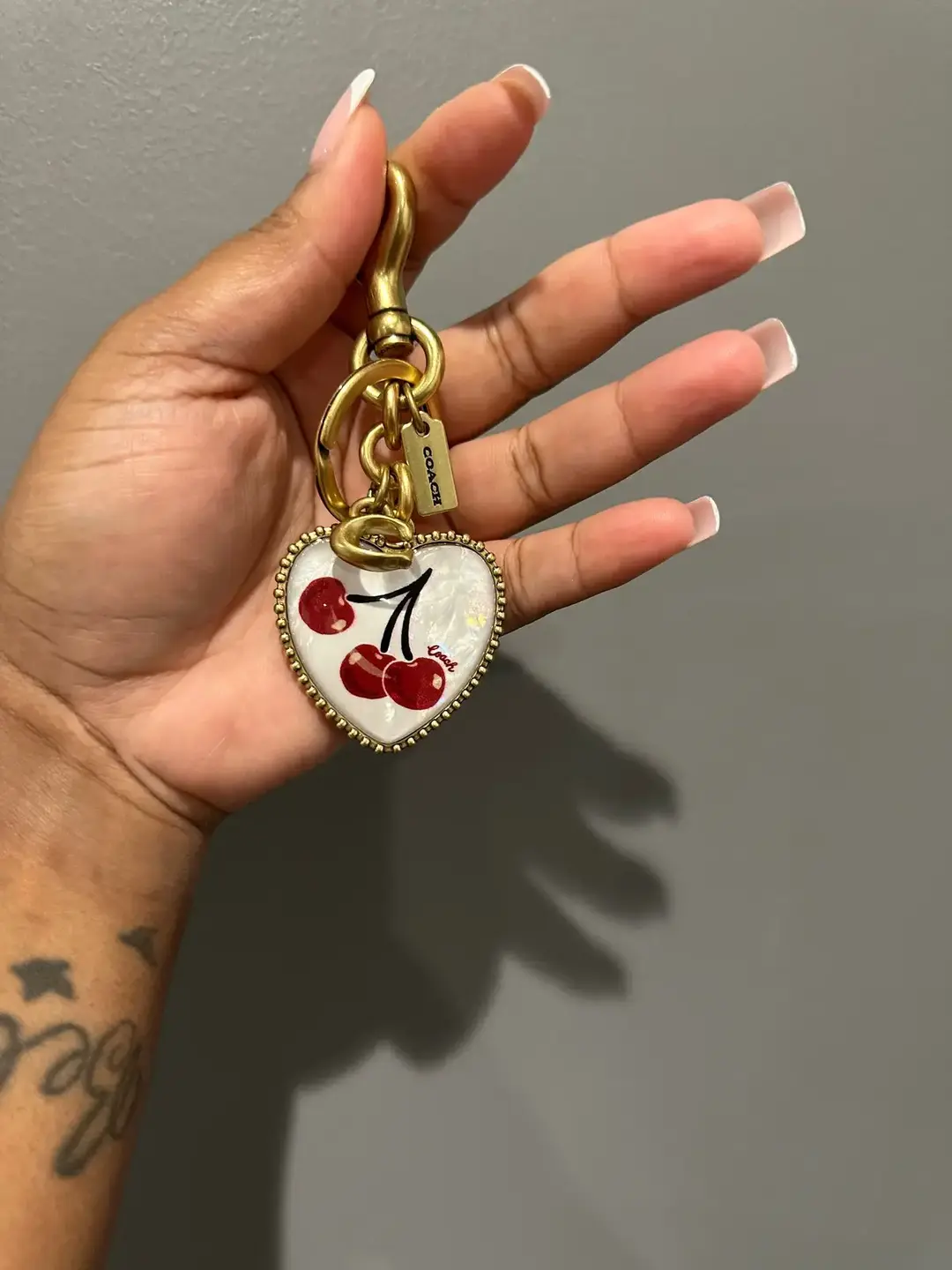 Am I becoming a charm girly? 👀😍🙂‍↔️ #coachcherrycollection #heartcharm #coach #charms #purseaccessories #cherrycharm #news #heart #thegrove #Love 