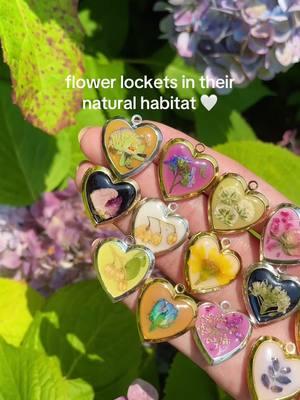 in a garden, of course 🥰💐 #explore #fyp #flowers #garden #locketnecklace #preservedflowers #heartlocket 