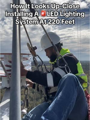 How it looks up close installing a new LED lighting system at 220 feet #towerclimber #changinglightbulb #lightbulb #towersalary #towertechnicians 