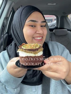 When one of your favorite pastry places listen to their customers and come out with a Mini Dubai chocolate Cake and It’s only $8 and their large one is $35.😍🙌  Location: 4107 15 Mile Rd, Sterling Heights, MI 48310 📍 #fyp #dubaichocolate #dubaichocolatecake #pistachio #foodreview #reviewvideo #tastetest #michigan #michigancheck #pistachiochocolate #dubaichocolatebar #sharmineats  