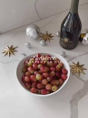 prosecco grapes 🍇🥂 link in bio to shop this post ✨🪩  How to prepare your grapes to count down to the New Year:  + Wash your bag of grapes + Add 2-3 cups of prosecco + 2 oz vodka + Chill overnight + Drain and then sprinkle and coat in sugar #cocktails #cocktail #newyear #Itkholiday #Itkparties #newyearsparty #happynewyear #nye  #nyeparty #hostingideas 