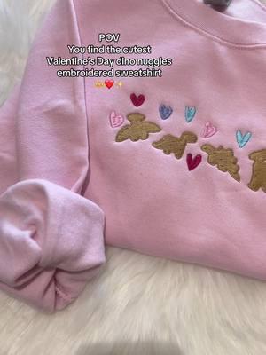 The cutest Valentines Day Dino embroidered sweatshirt 🩷 #fyp #smallbusinesstiktok #ValentinesDay #valentinesdaysweater #valentinesdaytok #catsoftiktok #cat #catslovers #catsweatshirt #valentinesdaysweatshirt