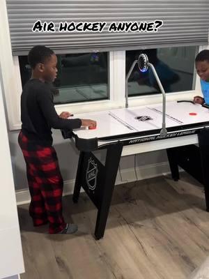 The kids playing with one of the new house toys. #christmasgifts #airhockey #gameroom 