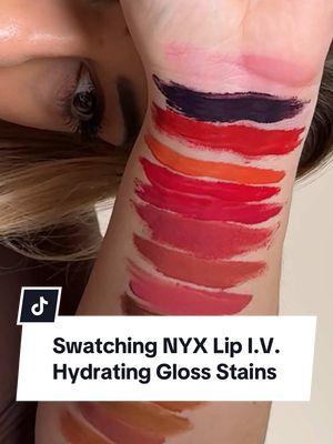 I just HAD to make a dedicated swatching video for @NYX Professional Makeup’s new Liquid Lip I.V. Glosses because they’re THAT good. The fact that they nailed something this glossy, this comfortable, and with this much color payoff with a soft stain—all at a drugstore price point? LOVE that. I swatched (almost) all of her shades so you can see them in their full glory — 14 of the 16 total. Enjoy beauty queens! And to be clear, NYX partnered with us on our last video to talk about these, but this video is an organic post of the swatches to help you get an understanding of the shade assortment. As always, partnerships are always disclosed here ❤️ Which shades are your favorite beauty queens?  #makeup #BeautyTok #drugstoremakeup #nyxcosmetics #lipgloss #lipstain #thelipsticklesbians 