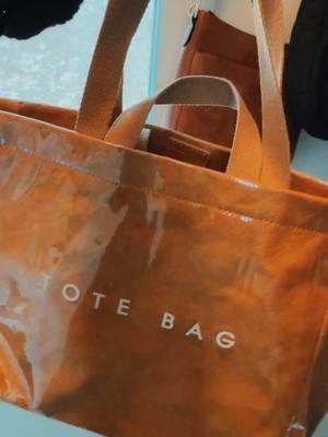 Nice deep tote bag with lots of room for books, computer, water bottle and more. Plastic exterior makes it easy to keep clean ! Short handle for carrying or shoulder strap to toss and go ! #totebag #viraltote #waterprooftote #plastictote #totebagfashion #fashionbag 