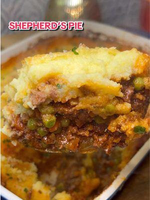 Shepherd’s Pie 🥧 The ultimate winter comfort food. Here’s how to make it:  The full recipe is also linked in my bio! For the Meat Filling: 1 lb ground lamb (or beef, if preferred) 1.5 tbsp olive oil 1 medium yellow onion, finely chopped 2 medium carrots, finely diced Salt and pepper, to taste 1 tsp red pepper flakes (optional) 4-6 cloves garlic, minced (to taste) 2 -3 tbsp tomato paste 1 tbsp flour 1/2 cup red wine (optional, for deglazing) 1 tbsp fresh rosemary, minced 1 tbsp fresh thyme, minced 1 cup chicken broth 1 tbsp Worcestershire sauce 1 bay leaf 1 cup frozen peas For the Mashed Potatoes: 2 lbs Yukon Gold potatoes, scored width-wise 1/4 cup butter, room temp 3/4 cup whole milk, room temp 1 clove garlic, smashed 1 sprig fresh rosemary 1 sprig fresh thyme 2 egg yolks 1/2 cup Parmesan cheese, grated plus more to top Salt, to taste Garnish: Fresh chives, chopped 1. Score the potatoes width-wise. Place them in a large pot, cover with cold water by an inch, and add a heavy hand of salt. Bring to a boil, then reduce the heat and simmer for 35-45 minutes, or until the potatoes are fork-tender. 2. While the potatoes are simmering, heat 1 tbsp of olive oil in a large skillet over medium heat. Add the onion and carrots, season with salt, pepper, and red pepper flakes, and cook for 5-7 minutes until softened. 3. Clear a center in the pan, add in a touch more olive oil, and add the lamb. Let it sit undisturbed to develop a crust, then season with salt and pepper. Break up with a wooden spoon and remove any excess fat, if desired. 4. Add the garlic and cook for another 30 seconds. 5. Clear a center in the pan, add the tomato paste, and let it cook off a bit before incorporating with the rest. Then let it cook for another 2-3 minutes. 6. Sprinkle in the flour and stir to combine. Cook for 2 minutes to cook out the raw flour taste. 7. Deglaze the pan with red wine (if using), letting it cook for 1-2 minutes. 8. Add the rosemary and thyme, and cook for another minute. 9. Pour in the chicken broth, Worcestershire sauce, salt, and pepper. Stir to combine. Add the bay leaf, bring to a simmer, and let simmer over low heat for 15-20 minutes, or until the potatoes are done. If the mixture seems to be drying out cover and/or add a touch more broth.  10. Preheat your oven to 400°F (200°C). 11. Once the potatoes are fork-tender, carefully peel and return them to the warm pot to dry off any excess water. If the pot has cooled off too much, turn the heat on low. 12. In a small saucepan, gently warm the milk, butter, garlic, rosemary, and thyme. 13. Rice the potatoes. Remove the garlic and herbs from the milk before pouring into the potatoes. Gently stir to combine. 14. Season with salt, add the egg yolks and Parmesan cheese, and gently fold everything together. Set aside. 15. Remove the bay leaf from the lamb mixture, and add the frozen peas. Let it simmer for 1-2 minutes. 16. Add the meat mixture to the bottom of a baking dish. Top with the mashed potatoes, raking a fork over the top to create texture. Sprinkle with more Parmesan cheese. 17. Bake for 30 minutes or until the top is golden and the edges are slightly crispy. 18. Let rest for 5-10 minutes before serving. Garnish with fresh chives and enjoy! #shepherdspie #comfortfood #cozymeals #winterfood #winterrecipes #dinner #DinnerIdeas #cozyrecipes #cozyrecipes #FoodTok #cooking #britishfood 