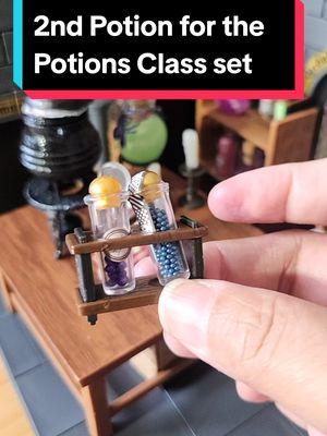 Made the 2nd potion in the Miniverse Potions Class set with my own resin. I think I like using my own resin better! Ever since the Miniverse recall it seems like the resin is a more glue consistency and takes forever to cure. Using my own resin it took seconds to cure the layers and it was easier to mix in the silicone container than the cauldron. I think I'm going to use my own resin going forward. any guesses what thus potion could be? cause I have no idea.  #HarryPotter #Miniverse #PotionsClass #PotionMaking #MiniPotion 