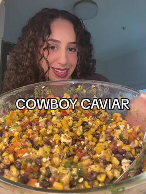 Cowboy Caviar 🤠 one of my absolute favorite dips! Inspired by @bria lemirande  RECIPE⬇️  INGREDIENTS 1 small orange bell pepper diced  1 small yellow bell pepper diced 1 red onion diced  1/3 cup pickled jalapeños  1 cup tomatoes diced  1 jalapeño diced 1/2 cup chopped cilantro  1 mango diced 1 can black beans 1 bag frozen fire roasted corn 1 6oz container crumbled feta cheese DRESSING 1/2 cup olive oil 1/4 cup white wine vinegar  3/4-1 packet taco seasoning (depending on how spicy you want it) 3 tbs honey Juice of 3 limes  Mis all together and enjoy with chips of your choice! I prefer the Elote Corn Dippers feom TJ’s #cowboycaviar #fitwsiscowboycaviar #dip #healthydip #potluck 