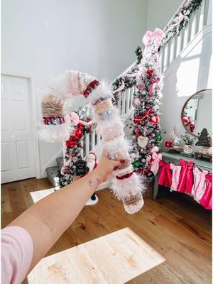 DIY Candy Cane Wreath ❤️🤍🩷 You can find these candy cane wreath forms at Hobby Lobby and Dollar Tree! Just grab some yarn, wrap, and tie knots in the back to secure. I loved added some sparkly embellishments as well! 💕 #diychristmasdecor 