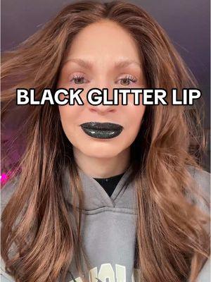 This liquid lipstick formula is like no other!! Can I pull off the black? 🫣 #blacklipstick #liquidlipstick #lipcombo #nyemakeup #glittergloss #queencosmetics 