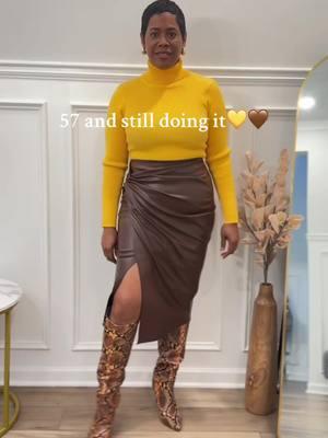 One more time for the skirt! 🤎✨👏🏽 I added a pop of color with this yellow turtleneck and paired it with a brown and yellow cardigan to tie it all together. The boots? Absolutely perfect for this look. And of course, the leopard print clutch was a no-brainer ✔️🐆. I’ve got a mix of neutral tones, vibrant color, and prints all in one outfit. What do you think of this combo? #ChicAndClassy #BrownIsTheNewBlack #otbfashions #over50ontiktok 