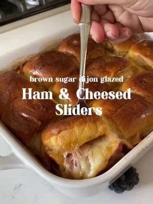 Looking for thee perfect New Year’s Eve appetizer?! You must try these  Brown Sugar & Dijon Glazed Ham and Cheese Sliders! They’re so incredibly easy to make and i guarantee that it’ll be the first dish that disappears! If you haven’t tried this holiday recipe before, now is the time!  ⭐️INGREDEINTS⭐️ ⭐️ 1 stick salty butter ⭐️ 2 tbsp brown sugar ⭐️ 2 Tbs. honey Dijon mustard ⭐️ 3 tbsp Worcestershire sauce ⭐️ 1 pack @kingshawaiian rolls ⭐️ 3/4 lb virgina ham, sliced thin ⭐️ 1/2 lb @tillamook swiss, sliced thin Or click the link in my profile or simply google funeral sandwiches and mine will pop up right here at this address!  https://grilledcheesesocial.com/2020/01/19/funeral-sandwiches/ #fypシ゚viral #fypシ #foryoupage #cheeserecipe #EasyRecipe #sliders #slidersunday #sliderrecipes 