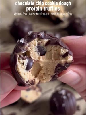 These Chocolate Chip Cookie Dough Protein Truffles are gluten free, dairy free, paleo, high protein, and refined sugar free, and the perfect New Year’s Treat! Recipe below. Cookie Dough: •3/4 cup cashew butter •1 tsp vanilla extract •1/4 tsp salt •1/4 cup coconut flour (see recipe notes if using almond or oat flour or cacao powder) •1/4 cup Truvani vanilla protein power •1/3 cup 100% cacao chocolate chips (or Hu Kitchen chocolate gems) Chocolate Shell: •1/2 cup Hu Kitchen chocolate gems •1/2 tbsp coconut oil OR •1/3 cup 100% cacao chocolate chips •1 1/2 tbsp coconut oil •2 tbsp room temperature maple syrup or honey Instructions: 1. Add the cashew butter, vanilla, and salt to a bowl and mix then add in the coconut flour, protein powder, and chocolate and mix until a dough forms. Add more flour if it’s too wet or more cashew butter if it’s too dry. 2. Scoop the dough and roll into balls then place the ball on a tray lined with parchment paper and freeze for 30 minutes. 3. After 30 minutes, melt the chocolate and coconut oil together (on the stovetop using the double boiler method or in the microwave). If using unsweetened chocolate, remove from the heat and stir in the maple syrup or honey. 4. Remove the balls from the freezer and coat in melted chocolate then return to the tray. Sprinkle with coarse sea salt then place in the fridge until the chocolate hardens, then dig in and enjoy! Recipe Notes •if using almond flour, use 1/3 cup •if using oat flour, use 1/4 cup + 2 tbsp •if using cacao powder, use 3/4 cup #cookiedough #ediblecookiedough #proteincookiedough #proteinballs #truffles #chocolatechipcookiedough #proteintreats #nobakedessert #vegantruffles #dairyfreedessert #healthydessert #refinedsugarfree #sugarfree 