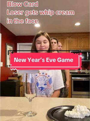 New Year’s Eve Game - blow the last card off the glass and you get whip cream in the face. #newyearsevegame #newyearseve 