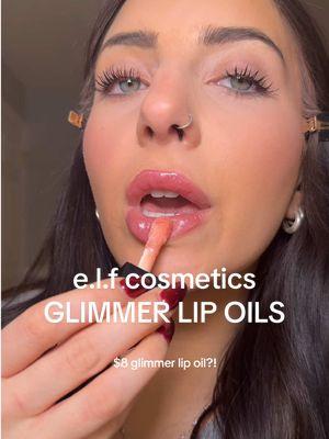 HOW is this $8?! These new glimmer lip oils from @e.l.f. Cosmetics are no joke. Super hydrating and cushiony smooth on the lips with a STUNNING glimmer! ✨ I used shade “candy coded” here the pinky one! #elf #elfcosmetics #glowreviverlipoil #glowreviver #shimmerlip #shimmerlipgloss #shinmerlipoil #elflipoil #elfglowreviverlipoil #elfglowreviver  #elfglowreviver #affordablemakeup #beautydeals #lipcombo #affordablelipcombo #affordablelipoil #lipoil #tiktokshopcreatorpicks #newyearnewaura #tiktokshopyearendsale #ttsbeautybesties 