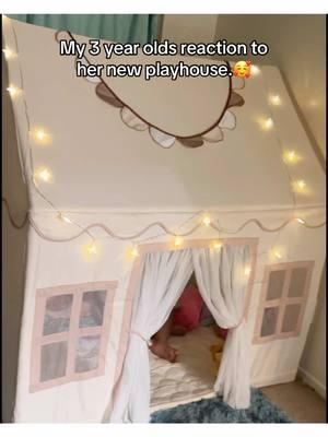 This indoor/outdoor Playhouse is too cute! It comes with everything shown, including the star lights. Took about 10 minutes to build. She loves it!!  You can find more info by clicking on the orange cart. 🛒  . . . . . . #reaction #surprise #toocute #toddlertok #giftideas  #playhouse #kidstoys #MomsofTikTok #playtime #kidsplayhouse #playtent #toddlersoftiktok #toddlermom #TikTokShop #montessori #fyp 