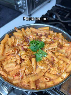 Starting 2025 with my favorite pasta recipe! It’s creamy, cheesy, and bursting with flavor. Here’s how I made it: Ingredients: 	•	Shrimp 	•	Bacon 	•	Rigatoni 	•	Tomato paste 	•	Heavy cream 	•	Pasta water 	•	Parmesan cheese 	•	White onion 	•	Red bell pepper 	•	Garlic 	•	Salt 	•	Black pepper 	•	Paprika 	•	Chili flakes Instructions: 	1.	Cut the bacon into small pieces and fry it in a pan. Remove the bacon but leave some of the fat in the pan. 	2.	Season the shrimp with salt, black pepper, and smoked paprika, and cook them in the same pan. Once done, remove them from the heat. 	3.	In the same pan, add more bacon fat along with chopped onion, red bell pepper, and garlic. Sauté until fragrant. 	4.	Add three tablespoons of tomato paste, a splash of pasta water, and 3/4 of a small carton of heavy cream. Mix until combined. 	5.	Stir in your al dente pasta of choice (I used rigatoni). 	6.	Shred some Parmesan cheese on top and add the cooked shrimp, crispy bacon, and chili flakes for an extra kick. And there you have it—an easy and delicious pasta recipe that will leave you craving more! [ easy pasta recipe, vodka pasta, spicy rigatoni recipe, cooking videos, easy recipe ideas, dinner ideas ] #pastarecipe #vodkapasta #DinnerIdeas #EasyRecipes #pastatiktok 