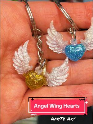 Angel Wing Resin hearts #amytbart #uvresin #uvresincrafts #uvresinkeychain #angels #angelwings #heart #death #rememberance #handmade #handmadegifts 