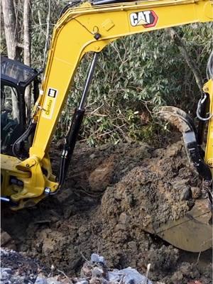 New retaining wall project off to a mushy and rocky start 😅 New video hit the channel today… ##dirtwork##bluecollarlife##retainingwall