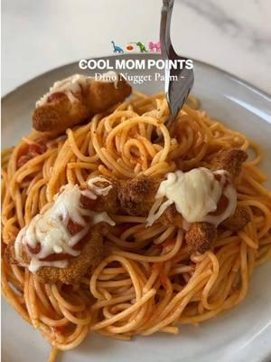 Cool Mom Points: Dino Parmesan 🦕  If your NY resolution is to make ONE dinner that the whole family will love, you’ll want to make this meal. It’s cool mom and kid approved.  A few tips to bump up the nutrition of this meal: 🎀 Use whole wheat or chickpea spaghetti for extra fiber and protein  🎀 Choose a marinara sauce with lower sugar  🎀 Pick nuggets that prioritize whole chicken breast meat as the primary ingredient.  🎀 Mixed together with steamed broccoli, green beans, or spinach.  SAVE to add to your weekly dinner rotation. You’re such a cool mom 😎  #coolmompoints #coolmom #whatsfordinner #dinonuggets #chickenparmesan #millennialmom #dinnerrecipe #resolution #nyresolution