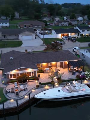 I would have never guessed the back looked like THIS… 😲🔥 A canal-side oasis with a boat dock, cozy fire pit, putting green, and grilling/bar area. @AntonelliLandscapePoolSpa can turn any backyard into the ultimate hangout spot, no matter the size. Who’s ready for a backyard upgrade this summer? #luxury #backyard #luxurylifestyle #outdoor #landscapes 