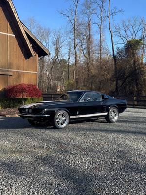 FOR SALE: 1-800-562-7815 at www.noreserveclassics.com | When the garage door opens, This 1967 Shelby GT500 Fastback #404 legend comes to life This 1967 GT500 is a powerhouse, equipped with the original 428ci Police Interceptor Motor for pure muscle performance, enhanced by Power Steering and Power Brakes for smooth handling and quick stops. The Extra Cooling Package, featuring a large radiator and single fan, ensures optimal temperature while the dual carburetors add extra power. Inside, the Black Decor Interior offers classic comfort with C-6 Automatic Transmission, Black Vinyl Bucket Seats, optional Rear Fold Down Seats, and authentic Shelby features like the wood-grain steering wheel and factory gauges. Its solid underbody, including the Red Oxide Paint, Rear Leaf Springs, and Ford 9” Rear End, ensure durability, while the custom 18-inch Shelby 427 Wheels make it a standout. With the Shelby Style Chambered Exhaust and an Elite Marti Report, this GT500 is a true collector's gem.