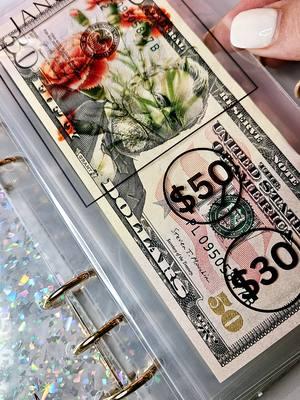 I'm starting my 2025 cash stuffing with this beautiful birth month flower savings.  In the end, I would have 1k. Join in the fun of savings and break the generation cycle of being in debt, and let's start building on generation wealth.  #financialjourney #2025glowup #generationwealth #holographic #funsavings #birthmonth  #cashstuffingsystem #savingsbook #savingstracker 