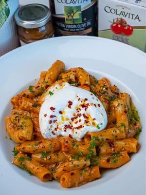 Sun-Dried Tomato Pesto & Cherry Tomato Rigatoni The moment I tasted the sun-dried tomato pesto from @Colavita, I knew I had to make pasta with it. This dish is vibrant, full of flavor, and exactly what I crave when I’m in the mood for Italian food. Their Roman Rigatoni pasta pairs perfectly with the sauce, and the burrata on top takes it to the next level. Find the full recipe below! Ingredients: 8 ounces Colavita Roman Rigatoni Pasta 3/4 to 1 cup grated Parmesan cheese (reserve some for garnish) 3 garlic cloves, finely chopped or minced 1/4 cup white wine 2 shallots, finely chopped 2 teaspoons black pepper Kosher salt, to taste 1 teaspoon red pepper flakes (optional) 4 to 6 tablespoons Colavita Premium Italian Extra Virgin Olive Oil 1 (13.76-ounce) can Colavita Organic Cherry Tomatoes 2 to 3 tablespoons Colavita Sun-Dried Tomato Pesto in Extra Virgin Olive Oil 6 to 8 fresh basil leaves For Serving: 1 burrata cheese Colavita Basilolio Basil Extra Virgin Olive Oil, to taste Red pepper flakes, to taste (optional) Chopped fresh parsley (optional) Instructions: 1. ⁠Heat a large skillet over medium heat and add 4 tablespoons of Colavita Extra Virgin Olive Oil. Add the chopped shallots and sauté for 1 to 2 minutes, until fragrant. 2. Add the Colavita Organic Cherry Tomatoes and minced garlic to the skillet, stirring to combine. Pour in the white wine and cook for 6 to 8 minutes, stirring occasionally, until the tomatoes are soft. **Optional: For a smoother texture, gently peel off the tomato skins using tongs. 3. Season the tomato mixture with kosher salt, black pepper, and red pepper flakes, if using. 4. ⁠Meanwhile, bring a large pot of water to a boil and add 1 tablespoon of salt. Cook the rigatoni according to the package instructions until al dente. Reserve 1 1/2 cups of pasta water before draining, and set the pasta aside. 5. ⁠Add the cooked pasta to the skillet and toss to coat in the tomato mixture. 6. ⁠Add 1/4 cup of grated Parmesan cheese and about 1/4 cup of the reserved pasta water to the skillet. Mix until the cheese melts and creates a creamy sauce. Gradually add more Parmesan and pasta water, as needed, to reach your desired consistency. 7. ⁠Stir in the Colavita Sun-Dried Tomato Pesto and fresh basil leaves, mixing well. 8. ⁠Serve the pasta warm with a whole burrata on top. Gently open the burrata and garnish with red pepper flakes, a drizzle of Colavita Basilolio, parsley, and extra Parmesan. **Tip: If a whole burrata feels too heavy, split it between two servings. Enjoy! #ad #colavita #colavitapartner #itstartswithcolavita #pasta #EasyRecipes #sundriedtomatoes #italianfood #rigatonipasta #burrata #weeknightdinner  Colavita, Sun-dried tomato pasta, Italian dinner recipes, Quick and easy pasta, Burrata recipes