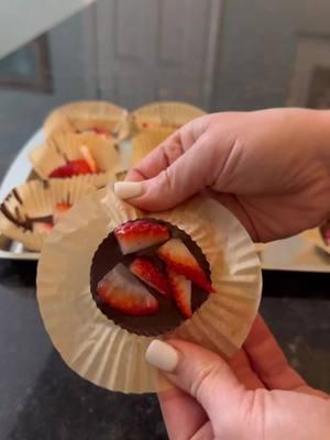 Chocolate strawberries, the easy way.  About 1.5 teaspoons of melted chocolate in a cupcake liner + a sliced up strawberry + five minutes in the fridge = the quickest little something sweet ever.  #strawberries #🍓 #chocolatestrawberries 