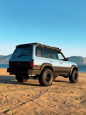 Finding peace in the waves, leaving tire marks in the sand 🌊 #toyota #landcruiser #fj80 #80series #details #build #beach #peace 