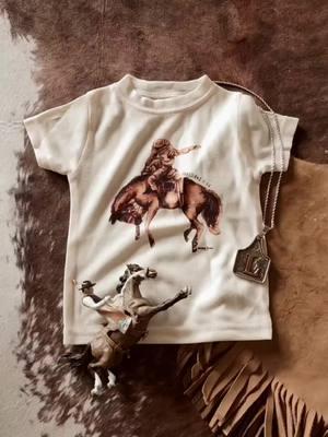 This incredibly soft tee features some amazing art done by one of our favorite shops! This is a must-have for your cowboy or cowgirl!  *Pair it with thist stunning cattle tag necklace from Virginia Handbags for some extra cowkid style! The quality is 🔥 Definitely solid with some nice weight to it! My girl is going to love wearing this! click the link!  #AD #cowkidstyle #chutehelp #rodeoarena #ranchkidsrock #westernboy #nationalfinalsrodeo #wildwestshow #cowboybooks #rodeohorse #holdontight #oldwest #rodeofamily #breakinghorses #sponsoredad  #cowboylife #goldbuckledreams #westerngraphictee #westernclothing #babyboy #cowboytoddler #babywesternwear #futurecowboyinthemaking #buckinbabies #ranchycowboy #broncridingnation #broncos #myfirstrodeo #kidsboutique 