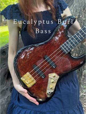 Eucalyptus Burl stained red with black burst. All gold hardware and Aguilar pickuos #customguitar #bassguitar #exoticwood 