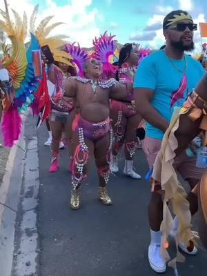 @carnivalslayersbackup Not all superheroes wear capes. Some wear carnival gems, glitter, and feathers 🥰🥰🥰. This is the type of love for carnival that we love to see ♥️🥰. The love and joy is present and this slayer is an inspiration to sooo many. Not only a survivor but most certainly a slayer. @carnivalaunty we love this and salute you  🎊💞🙏🏾 📷 @carnivalpulse  #carnival #saintkittscarnival #saintkitts #2025 #explorepage #reels #breastcancersurvivor