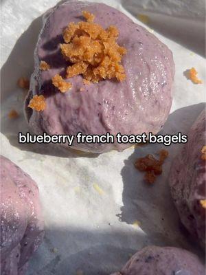 Replying to @minnie_mouse4040  1 1/2 cup blueberries, frozen or fresh 1/2 cup warm water + 1 tbsp  1 1/2 tsp dry active yeast 2 tbsp granulated sugar  3 1/2 cup all purpose flour  1 tbsp maple syrup  1 tsp salt  1 egg + 1 tbsp water for egg wash for the French toast mixture: 3 tbsp brown sugar, 1 tbsp granulated sugar, 2 tbsp maple syrup, 1/2 tsp cinnamon  1. In a small saucepan heat blueberries over stovetop with 1 tbsp water. Once simmering, turn off heat and gently mash berries with a fork or spoon to release juices.  2. In a large bowl, combine water, yeast & sugar in a large bowl. Let stand for 5-10 mins until foamy. Add flour, salt, syrup and blueberry mixture — if using a stand mixer, mix using dough hook on medium speed for 5 mins until a smooth dough ball forms. If not, stir to combine mixture, transferring to a cleaned surface to form dough and knead for about 10 mins.  3. Place dough in an oiled bowl and cover with plastic wrap, let rise on the counter for an hour. Once risen, cut into 6-8 equal sized pieces and roll into balls. Cover with a towel and let rise for 10 mins.  4. Poke holes in dough balls to form bagel shape. Cover once more with a towel for 30 more mins. In a large pot, bring 6-8 cups of water to a simmer with 3 tbsp brown sugar. Poach bagels on each side for 1 min each. I poach 2 at a time.  5. Arrange poached bagels on a lined baking sheet and coat in egg wash & top with sugar mixture. Bake at 425 F for 20-25 mins. Enjoy! xo Hailey 💙 #Recipe #newyear #homemadefood #newyeargoals #healthy #madefromscratch #homemadebread #homemadebagels #breadtok #breadmaking 