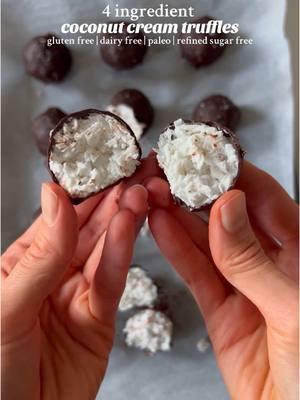 4 Ingredient Coconut Cream Truffles! They’re gluten free, dairy free, and refined sugar free, and can even be made sugar free!  Ingredients: •1/3 cup coconut cream •3/4 cup shredded, unsweetened coconut •1/3 cup dark or semi-sweet chocolate (I used dairy free and refined sugar free chocolate — use sugar free chocolate to keep the recipe sugar free) •1 tsp coconut oil Instructions: 1. Mix together the coconut cream and shredded coconut in a bowl then scoop the mixture with a tablespoon or cookie dough scoop and roll into balls. 2. Place the balls on a tray lined with parchment paper and place in the freezer for at least 1-2 hours to harden. 3. Once the balls are hardened, melt the chocolate and coconut oil in the microwave or using the double boiler method, stirring frequently until melted. 4. Once the chocolate is melted, remove the coconut balls from the freezer and dip each one in the melted chocolate. Place the chocolate coated balls back on the lined tray and sprinkle with flaky sea salt (optional).  5. Place the truffles in the fridge until the chocolate shell hardens, then dig in and enjoy! Store leftovers in the fridge. Notes: •For a sweeter truffle filling, use sweetened coconut flakes or add a little bit of a natural sweetener to the truffle filling (e.g. honey, maple syrup, coconut sugar) •If the filling is too dry, add more coconut cream. If it’s too wet, add more coconut flakes. #coconutcream #chocolatecoconut #truffles #vegantruffles #refinedsugarfree #healthydessert #nobakedessert #sugarfreedessert #paleodessert #glutenfreedessert #almondjoy #moundsbar