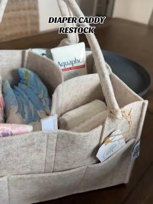 I could not live with out our diaper caddy that we keep in the living room! I keep all our baby essentials, diapers, and wipes in it. #momlife #momof4 #sahm #sahmof4 #newbaby #diapercaddy #babyessentials #babyitems #diapercaddyrestock 