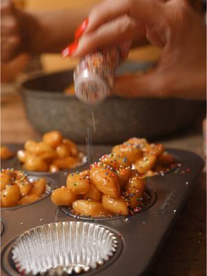 Even though Christmas is over doesn’t mean you have to stop making Pignolata, aka struffoli. In our family we also made it for New Year’s, Easter or any celebration.  This is an old simple recipe passed on by my mom’s grandmother. It’s simple.  All you need is eggs, flour and honey. That’s it.  The more eggs you use the more dough it makes. You want to use an even number of eggs. You can do 4, 6, 8, eggs.  Then comes the flour. We use semolina flour. You then begin adding flour a little at a time, mixing in intervals until the dough comes together. Then kneeding the dough, adding flour a little at a time until very smooth and firm. Make sure not to add to much flour. The dough will get to hard.  Roll out the dough in small thin strips. Do not add to much flour when rolling. You won’t be able to work the dough. Cut small little pieces and add to flour so they do not stick together.  In Pot Add vegetable oil for frying halfway through. Pina doesn’t measure 🤣 but that’s our guess. Let the oil heat up a little and then add the dough. Make sure the oil does not get to hot other wise the dough will split open. Keep removing the oil from heat for 10 min so it doesn’t get to hot.  Ideally, you should only cut the amount you will fry at a time. While the oil cools down in between frying you can cut the next batch. Makes the time go by faster 👍🏻 They are done when they achieve a golden brown color.  Lastly, heat up some honey in a frying pan. Mix in the coated until coated.  Years ago, my nonna started adding them into little cupcake holders for a less sticky mess.  Edited by: @niCOOL   #struffoli #pignolata #italiantraditions #italian #italianmom #sicilian #baking #desserts #italiandesserts  #pinaskitchen #frieddough  