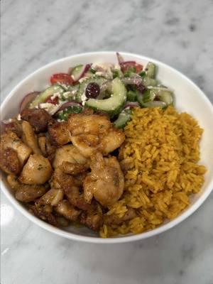 Lemon pepper chicken and rice bowl.                                            Recipe: Lemon pepper chicken: 1 1/2 lb boneless skinless chicken thighs, chopped into medium sized cubes  1 tbsp olive oil  2 tsp Kosher salt  1 tsp pepper  5 garlic cloves, minced 1/2 lemon, zested  1 tsp onion powder  1 tsp cayenne pepper  2 tsp paprika  -Cover chicken in olive oil and add all seasonings. Mix until chicken is fully coated. Bake at 400°F for 35-40 minutes, flipping halfway through. Butter compound: 1/2 stick of butter, partially melted  1 tbsp parsley, minced 1/2 tsp salt  1/4 tsp pepper  1/2 tsp garlic powder  1/2 tsp onion powder  1/2 tsp paprika 1 tsp honey  a splash of lemon juice  -Mix all ingredients together and toss the chicken in the butter compound until evenly coated.  Rice: 2 cups jasmine rice, washed 2 1/4 cups chicken stock  1 1/2 tbsp olive oil  2 tsp salt  1 tsp turmeric  1 tsp dried parsley  1 tsp garlic powder  1 tsp paprika  1 tsp onion powder  1 bay leaf  -In a medium sauce pan over medium heat, add olive oil and seasonings. Cook, stirring for about 1 minute. Add rice and mix until rice is fully coated in seasonings. Add chicken stock and bay leaf. Bring rice to a boil, mixing occasionally until almost all liquid has been absorbed. Turn heat to your lowest setting and cover for 20 minutes.  Salad dressing: 2 Tbsp red wine vinegar  1 Tbsp lemon juice  1 tsp dried oregano  1/4 tsp kosher salt  1/4 tsp pepper  2 tsp Dijon mustard 1/4 cup olive oil  1 tsp honey  -Mix all ingredients together until fully combined.  #chicken #rice #food #EasyRecipe 