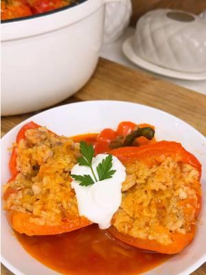 Ukrainian Stuffed Peppers with Tomato Sauce ✨ Ingredients: Peppers & Filling: 	•	6 large bell peppers (red, orange, or yellow) 	•	1 1/2 lbs chicken thighs, boneless and skinless (diced) 	•	4 tbsp avocado oil, divided 	•	2 medium onions, diced 	•	4 medium carrots, shredded 	•	2 tbsp unsalted butter 	•	1 tbsp tomato paste 	•	1 tsp sugar 	•	1 cup uncooked short-grain rice 	•	1 1/2 tsp Johnny’s seasoning salt 	•	Salt and black pepper to taste Tomato Sauce: 	•	1 (14.5 oz) can petite diced tomatoes 	•	2 cups water or chicken broth 	•	1 tsp Johnny’s seasoning salt 	•	Salt & black pepper to taste Instructions: 1. Cook the chicken:  Sauté diced chicken in 1 tbsp oil with 1 tsp salt and 1/4 tsp pepper until browned and cooked through. Transfer to a large bowl. 2. Cook the veggies:  In the same skillet, add 2 tbsp butter, 3 tbsp oil, and diced onions. Sauté for 3 minutes, then add shredded carrots. Sauté 8 minutes, stir in tomato paste, sugar, 1/2 tsp salt, and 1/8 tsp pepper, and cook for 2 more minutes. Add half the veggie mix to the chicken bowl and the other half to a bowl for the sauce. 3. Par-cook the rice:  Rinse rice, boil for 5 minutes, then drain. Add the rice to the chicken and veggie mix. Season with 1 1/2 tsp seasoning salt, 1/2 tsp salt, and 1/4 tsp pepper. Stir well. 4. Stuff the peppers:  Remove the tops and seeds of the peppers. Stuff peppers with the chicken-rice mixture, leaving a small space for the rice to expand. Replace pepper tops. 5. Arrange & make the sauce:  Place peppers snugly in a pot. Mix the reserved veggie mixture with petite diced tomatoes, water (or broth), and seasoning. Pour over peppers. 6. Bake:  Bring the pot to a boil on the stove, then cover and bake at 350°F for 45-50 minutes, or until rice is tender and peppers are soft. 7. Serve:  Plate the peppers with sauce and a dollop of sour cream. Enjoy! #stuffedpeppers #peppers #stuffedpeppersrecipe #ukranianfood #slavicrecipes  #DinnerIdeas #dinnerrecipe #comfortfood #mealideas 