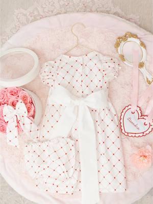 Make Valentine’s Day extra special with this sweet dress set, featuring cotton fabric adorned with delicate red hearts. Perfect for celebrating milestones, holiday photos, or creating cherished memories, this romper combines timeless charm with thoughtful details.  #newbornbabygirl #classicbabyclothing #ValentinesDay #babygirlclothes #babygirlootd 