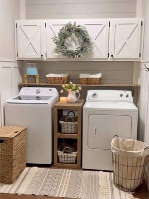 The process of Styling my laundry room to make it both aesthetic and functional!  I like to use lots of baskets in here. Baskets for clean clothes, dirty clothes, and in the cubbies for extra storage! The cubby baskets hold my mop pads and vacuum cleaner parts.. lol My cabinets hold my extra detergent, light bulbs, air wick air fresheners, and batteries. The hooks on the right wall are also super handy. They hold the clothes that I put on hangers until I put them away.  I wish it was always as clean as it is in this video…. 😂😂 What all do you keep in your laundry room? #laundryroom #laundryroomdecor #laundryroomorganization #laundryroomfinds #laundrytips #laundryhacks #laundryroomgoals #laundrytime #laundryroomideas 