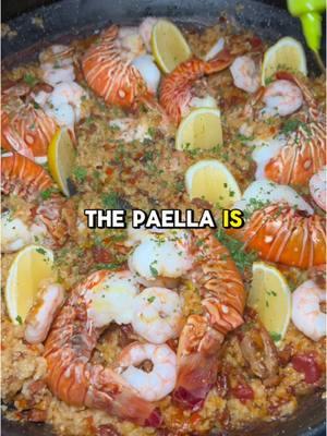 Authentic Spanish Paella 🥘🇪🇸 recipe ⬇️ Serves 6-8 5 oz Spanish chorizo, diced 1 lb chicken thighs, cut into 1/2 inch chunks 2 tbsp olive oil 1 yellow onion, finely diced 1 red bell pepper, finely diced 5 cloves garlic, minced 1 14 oz canned diced tomatoes  1-2 bay leaves 2 tsp smoked paprika 1 cup dry white wine 3 cups bomba or Valencia rice 1 pinch of saffron threads 5-6 cups chicken or seafood stock 1 lb shrimp deveined 2 large lobster tails, deveined and split in half 2 lemons, cut into wedges for serving fresh parsley for garnish In a large pan on medium high heat, sauté chorizo until crispy. Use leftover grease to sear chicken thighs. Once they develop some nice color remove from the pan. Add in onion and red bell pepper and cook until softened. Add in your garlic and mix until fragrant. Pour tomatoes, bay leaves and paprika. Mix and pour wine. Let it simmer and evaporate most of it. Add in rice, mix around and slightly toast it. Add your proteins back in along with a pinch of saffron threads. Pour chicken stock over rice. Jiggle pan side to side to balance out the rice. Let this cook uncovered for 15-18 minutes of medium low heat. You may have to use more water depending on your pan and burner. Once the rice is softened, layer your lobster tails flesh side down and your shrimp. Cover with aluminum foil for a few minutes and once the lobster is bright red you’re good to go. Garnish with lemon and parsley. #paella #paellas #paellalovers #spanishfood #onepotmeal 